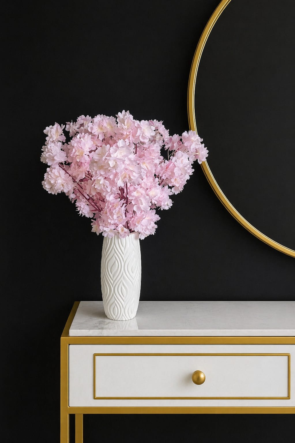 Elegant artificial flowers in a textured white plastic vase